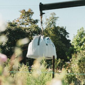 1 yard bulk bag of soil developer being delivered into yard